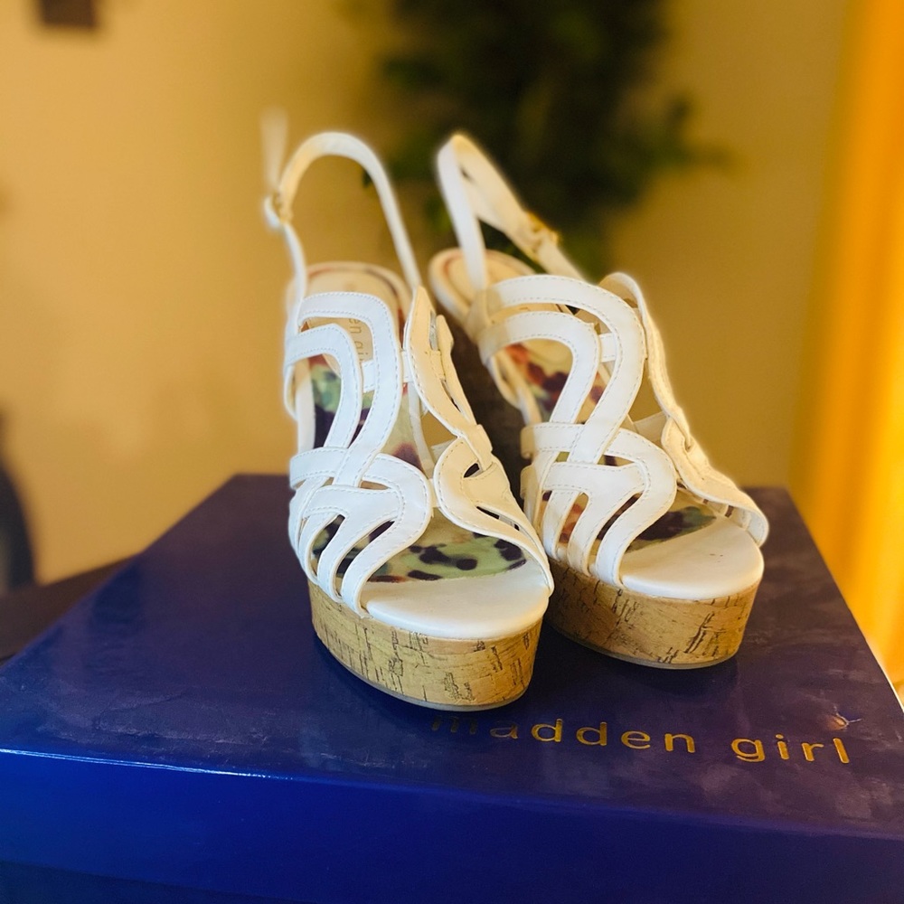 Women’s white wedges.